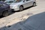Плашат с прокурор мъж, съобщил за дупки по пътя