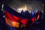 Бивш лидер на ПЕГИДА със значка на българските отряди за лов на бежанци
